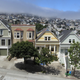 Residential houses line a street in Mission district near Delores Park as typical summer fog rolls in in San Francisco.